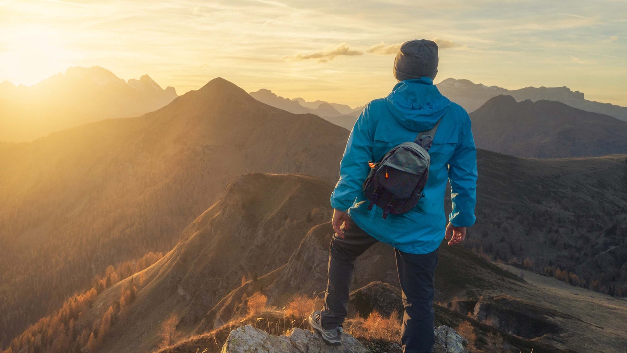 man wearing a calla backpack while hiking
